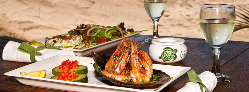 Delicious Mozambique cuisine and prawns served on the beach.